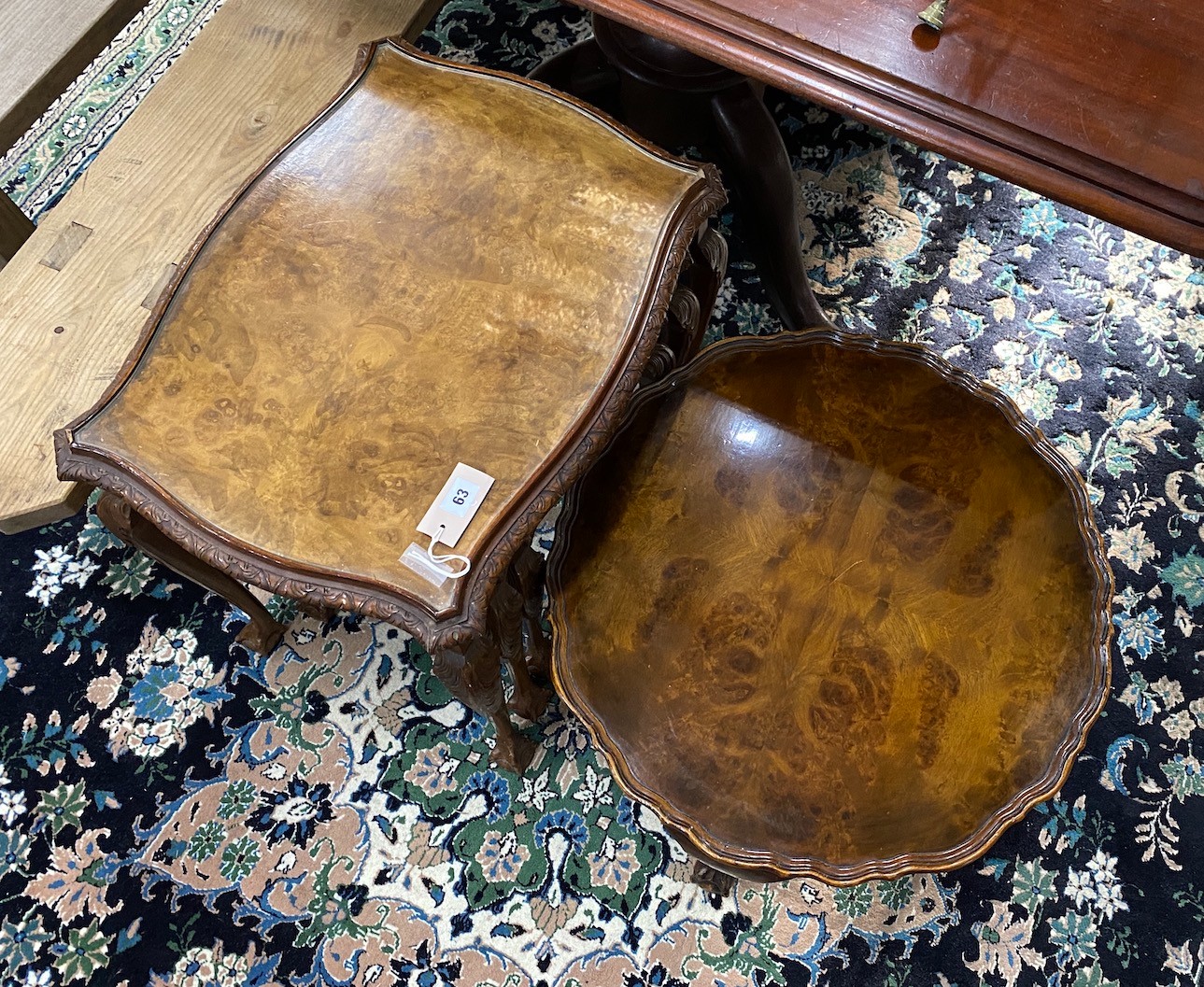 A Queen Anne revival nest of three walnut tea tables, width 58cm, depth 44cm, height 58cm together with a similar circular walnut coffee table
